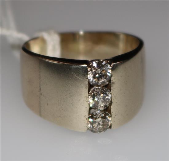 A three stone diamond ring, size N.